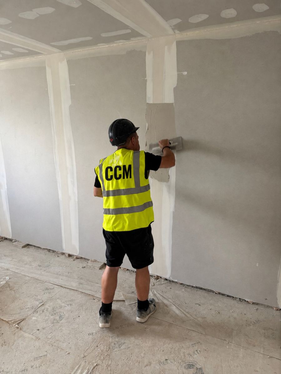 Cornwall Construction Management dry liner boarding and finishing a wall on a Cornwall site